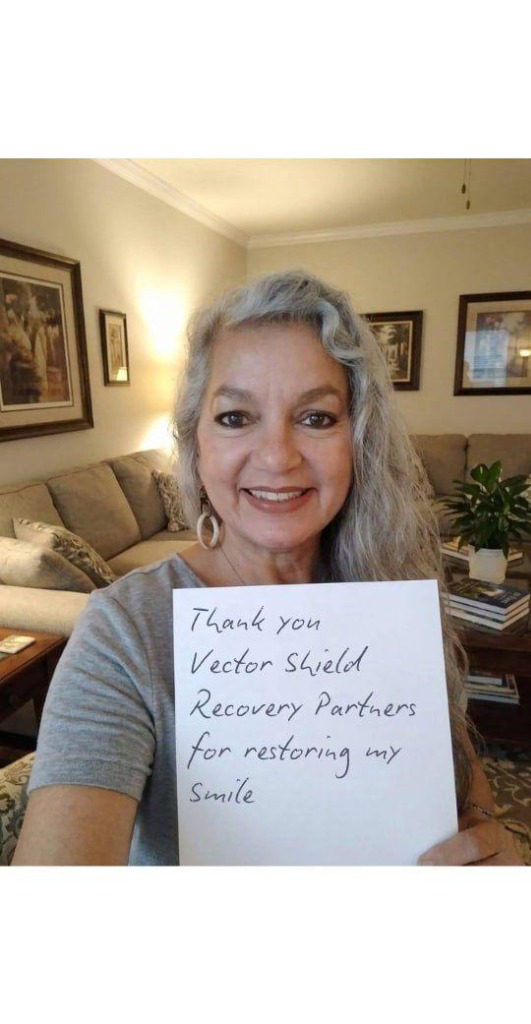 Client expressing gratitude with a sign